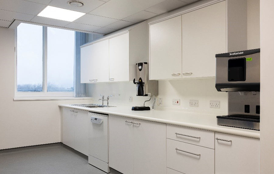 Room with white cupboards at Ward 18