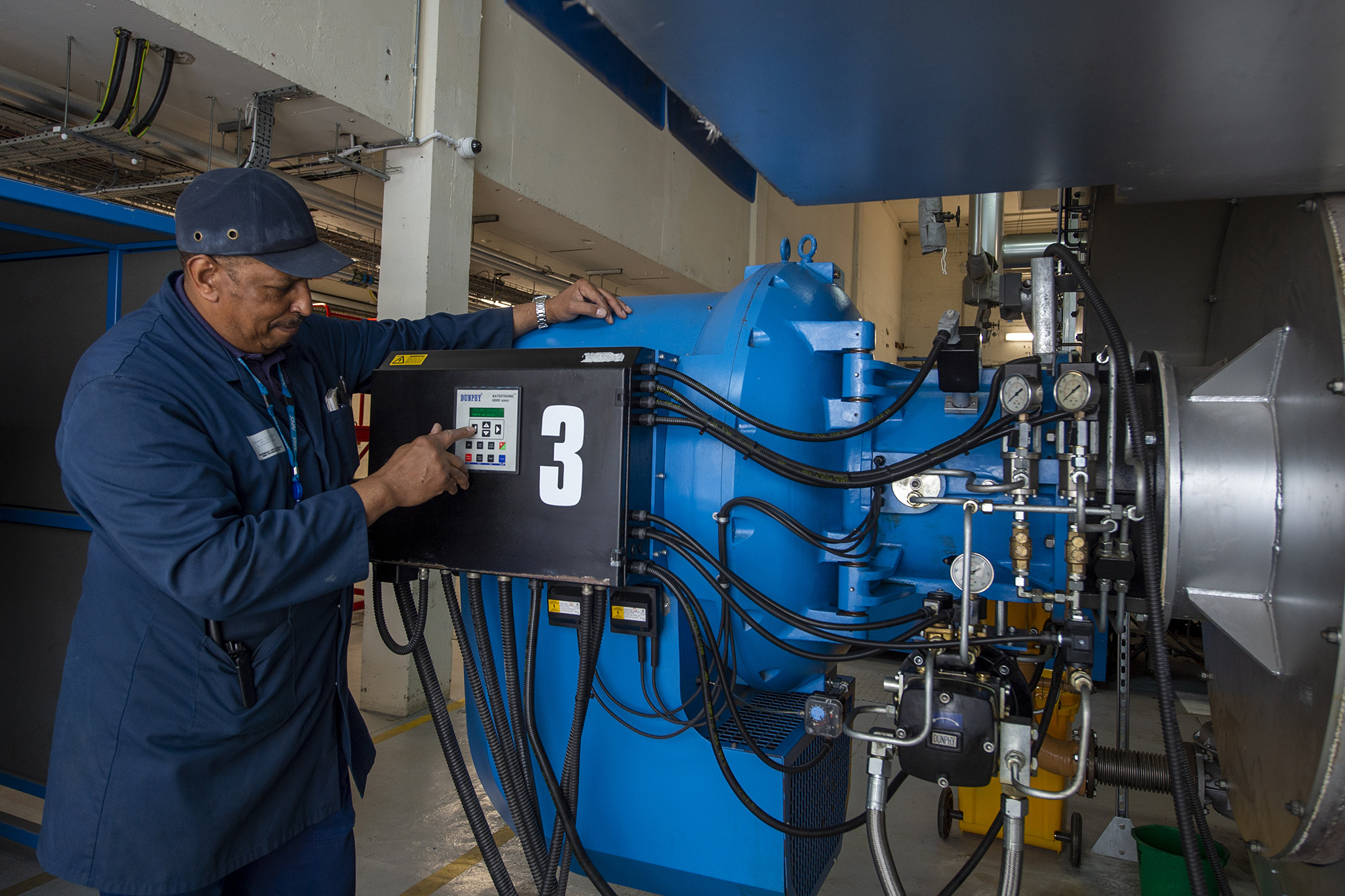 Male member of staff working machinery.