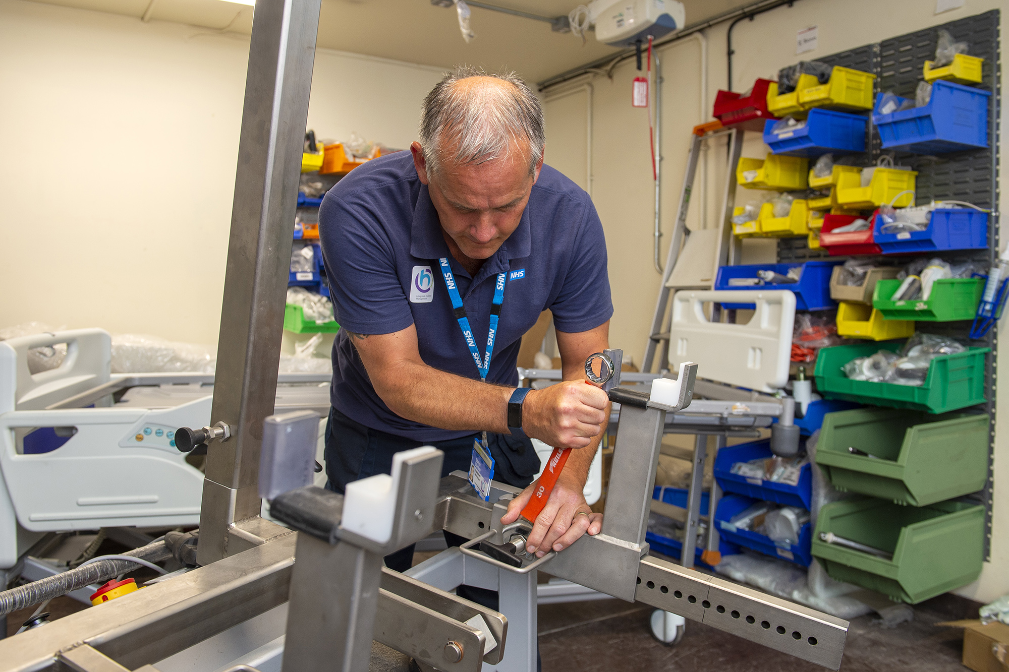 Male staff member fixing equipment.