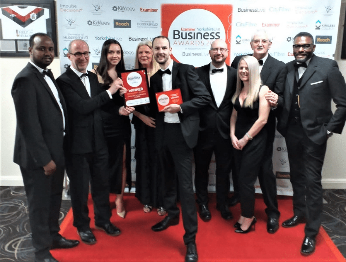 CHS staff celebrating their win at the Examiner Business Awards.